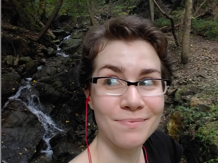 Selfie taken in front of a small stream while hiking in a Pennsylvania forest